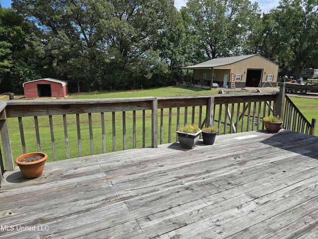 447 Shaker Dr, Senatobia, MS 38668 - deck with an outbuilding, a yard, and a storage shed