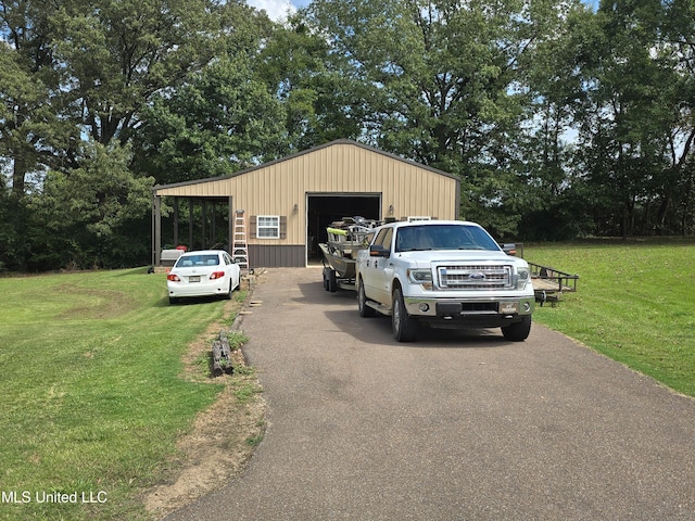 447 Shaker Dr, Senatobia, MS 38668 - view of outbuilding with driveway and an outdoor structure