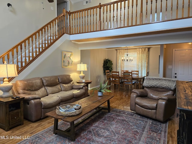 447 Shaker Dr, Senatobia, MS 38668 - living area featuring a high ceiling, stairway, and wood finished floors
