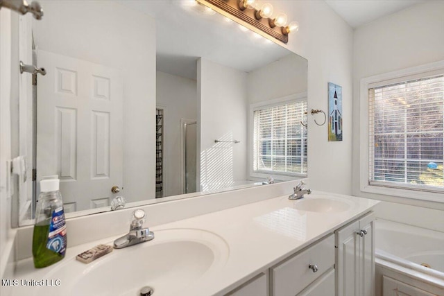 bathroom featuring a bathing tub and vanity