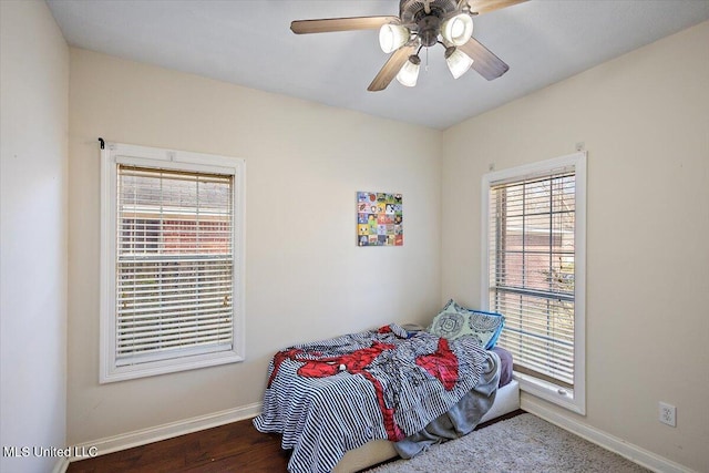 bedroom with ceiling fan and hardwood / wood-style floors