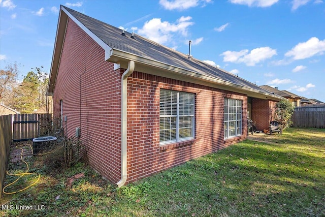 view of home's exterior with a yard