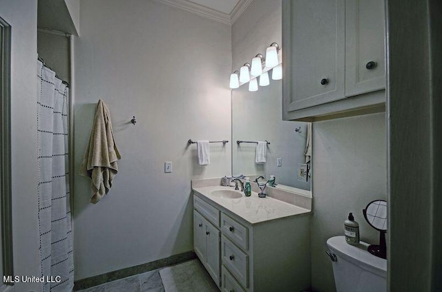 bathroom featuring vanity, ornamental molding, and toilet