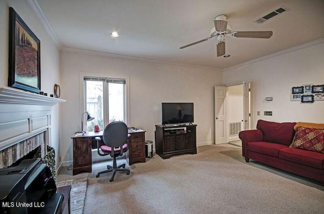 carpeted office space with crown molding and ceiling fan