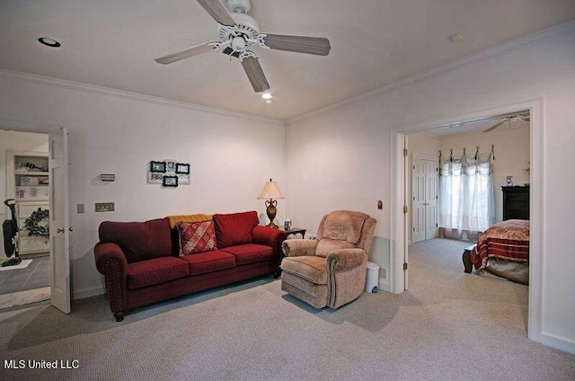 living room with crown molding, carpet floors, and ceiling fan