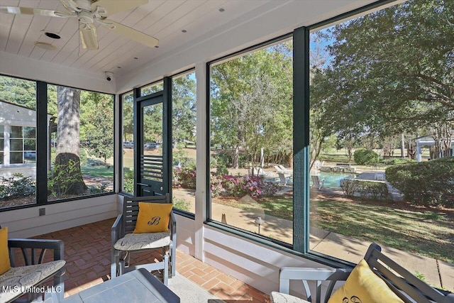 sunroom / solarium with ceiling fan