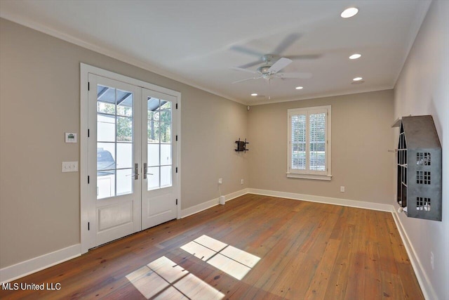 entryway with french doors, hardwood / wood-style flooring, crown molding, and ceiling fan