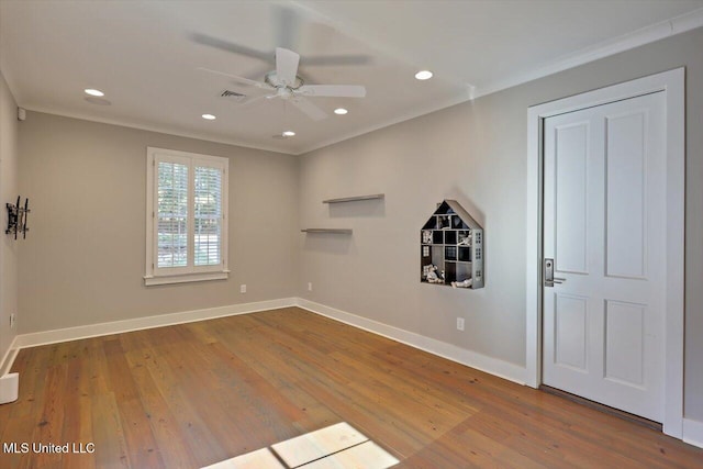 unfurnished room featuring ceiling fan, crown molding, and hardwood / wood-style floors