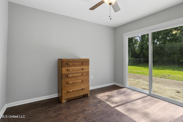 146 Greer Dr, Pearl, MS 39208 - empty room featuring dark wood-type flooring, baseboards, and ceiling fan