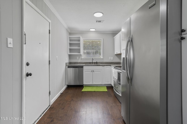 146 Greer Dr, Pearl, MS 39208 - kitchen featuring stainless steel appliances, crown molding, a sink, white cabinets, and dark wood-style floors