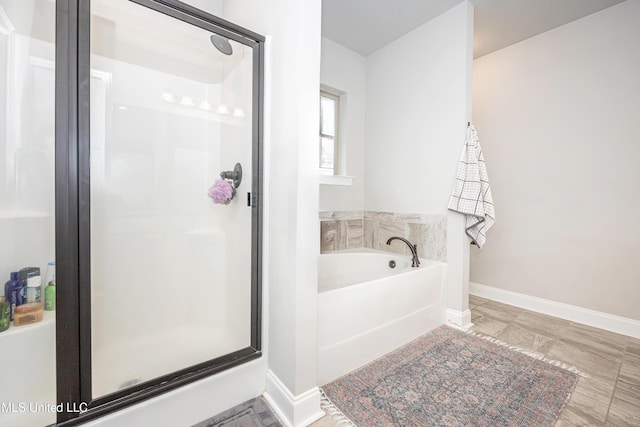 bathroom with independent shower and bath