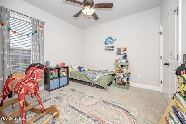 carpeted bedroom with ceiling fan