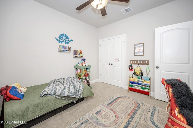 bedroom with light carpet and ceiling fan