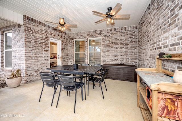 view of patio / terrace with ceiling fan and exterior bar