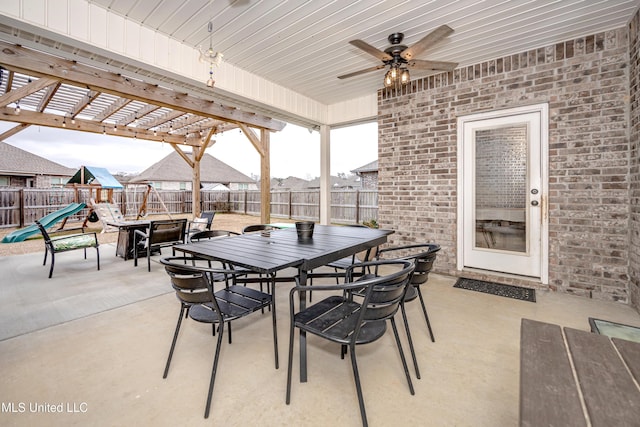 view of patio / terrace featuring a playground and ceiling fan