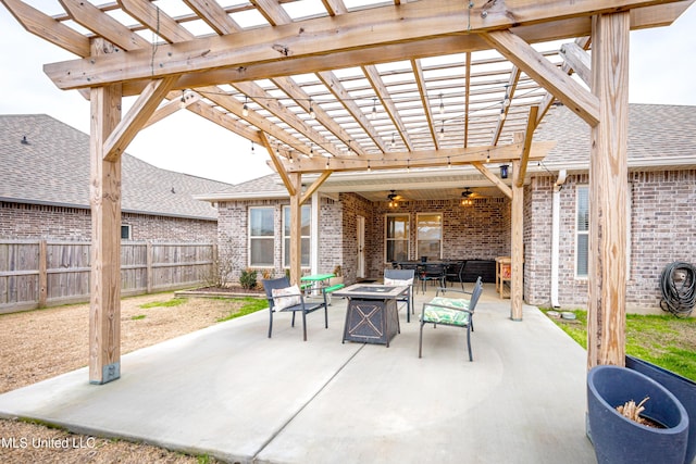 view of patio featuring a pergola and an outdoor fire pit