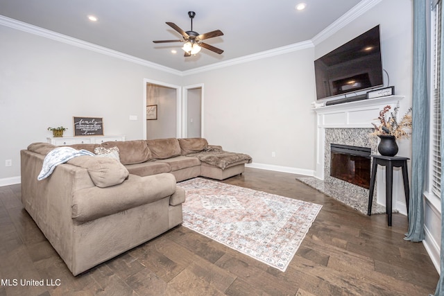 living room with dark hardwood / wood-style flooring, crown molding, a premium fireplace, and ceiling fan