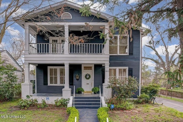 view of front of property with a porch and a balcony