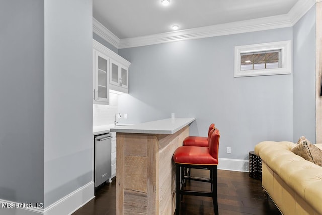 bar with stainless steel dishwasher, decorative backsplash, ornamental molding, white cabinets, and dark hardwood / wood-style flooring