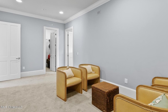 living area with crown molding and light colored carpet