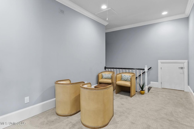 living area featuring crown molding and carpet floors