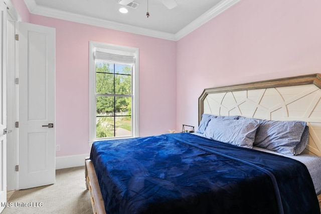 bedroom featuring ceiling fan, carpet, and ornamental molding