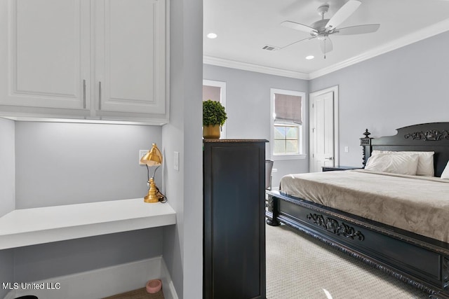 bedroom featuring ceiling fan, light carpet, and crown molding