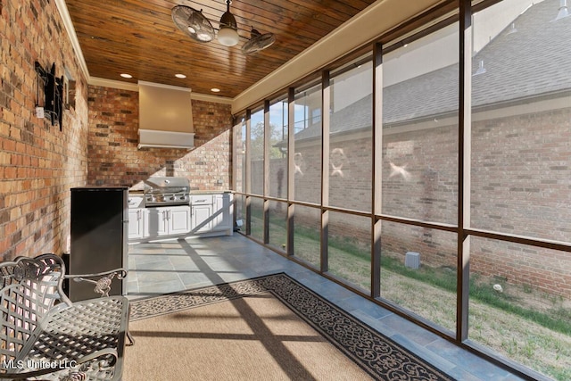 unfurnished sunroom with wood ceiling