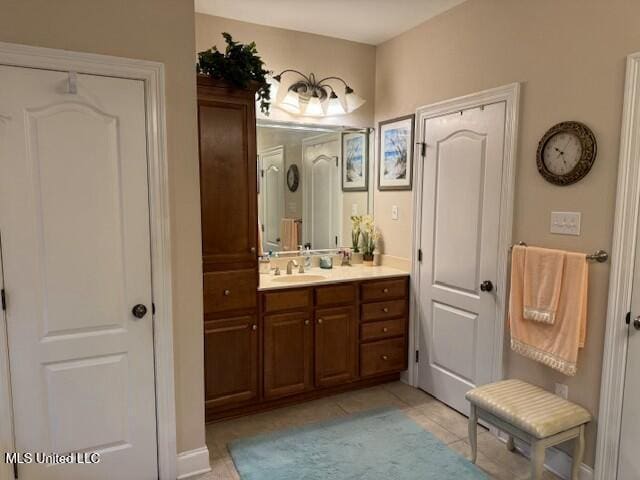 bathroom featuring vanity and tile patterned flooring