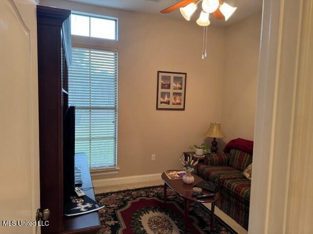 living room with ceiling fan