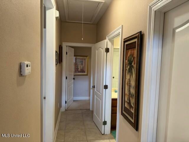 hall featuring light tile patterned floors