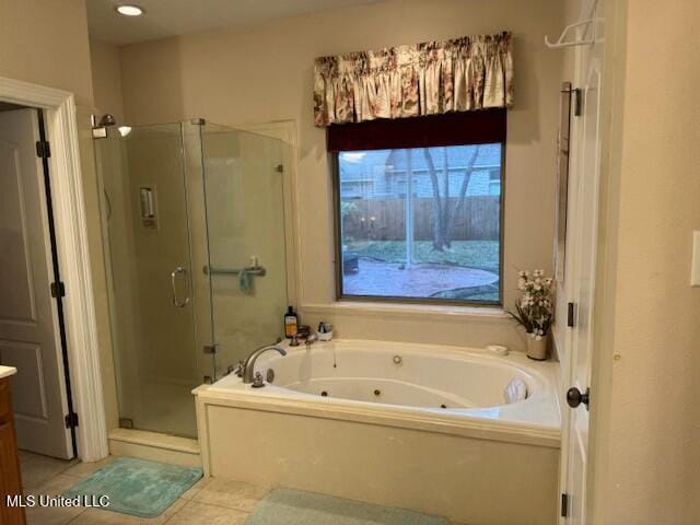 bathroom with independent shower and bath, tile patterned floors, and vanity