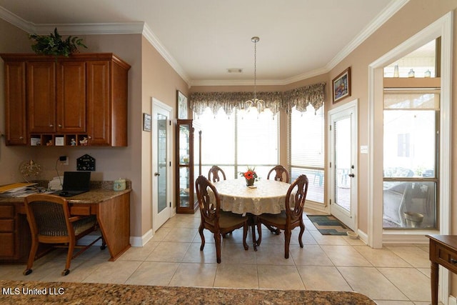 dining area featuring light tile patterned floors, crown molding, and a chandelier