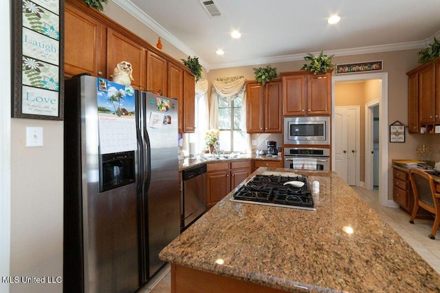 kitchen featuring light tile patterned floors, crown molding, light stone countertops, and appliances with stainless steel finishes