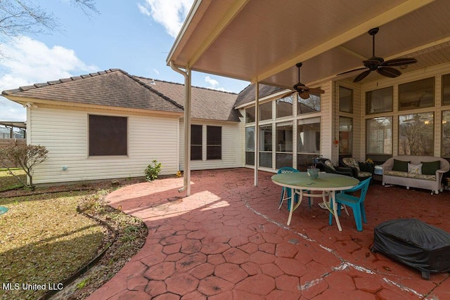 view of patio with outdoor lounge area and ceiling fan