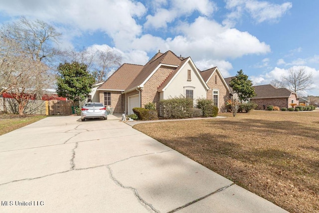 view of front of home with a garage and a front yard