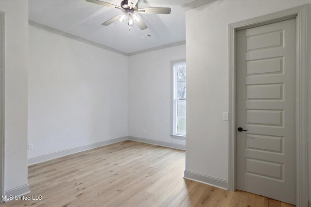 spare room with light wood-type flooring, ceiling fan, and crown molding