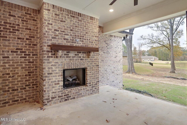 view of patio featuring an outdoor brick fireplace