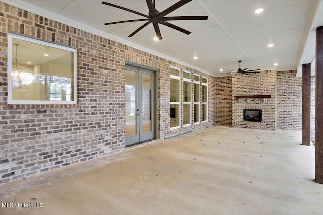 view of patio / terrace featuring a fireplace and french doors