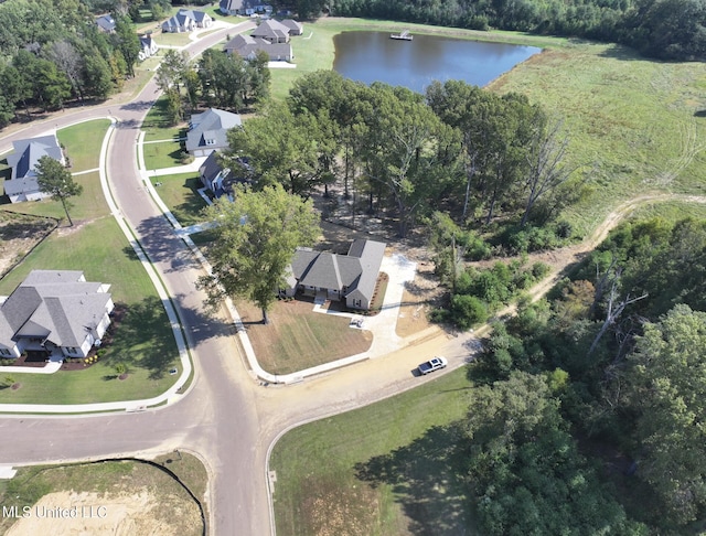 birds eye view of property with a water view