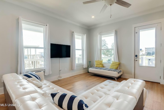 living room with recessed lighting, a ceiling fan, baseboards, and light wood finished floors