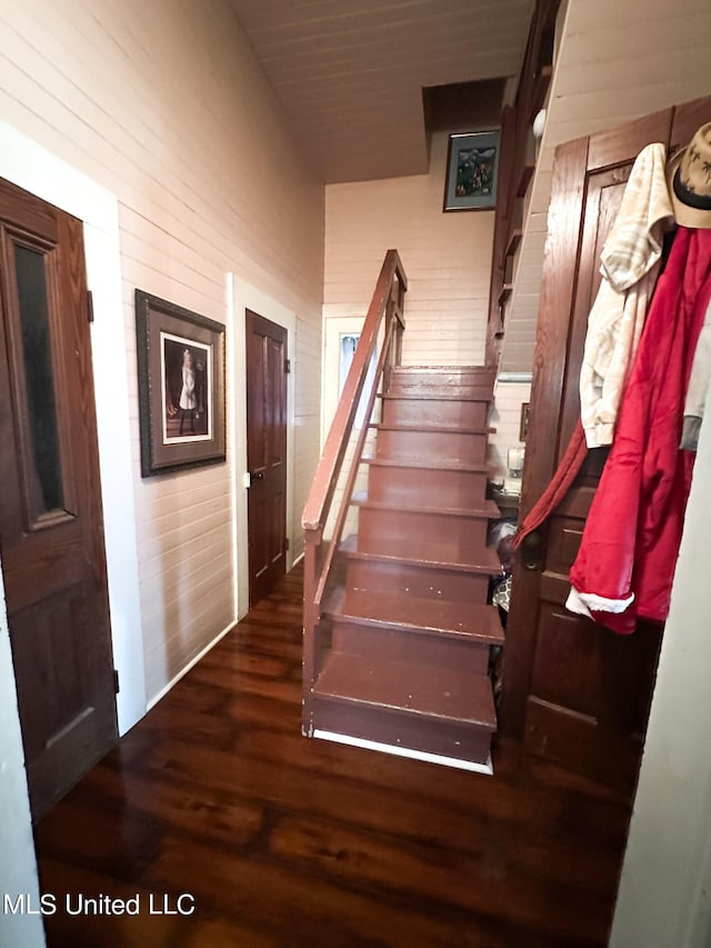 stairs featuring wood-type flooring