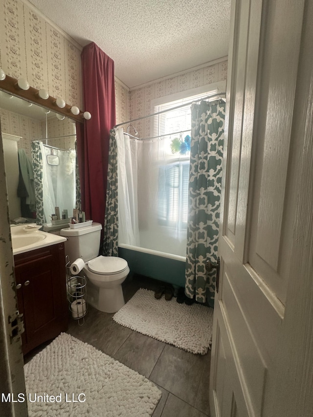 full bathroom with a textured ceiling, shower / bath combination with curtain, toilet, vanity, and tile patterned flooring