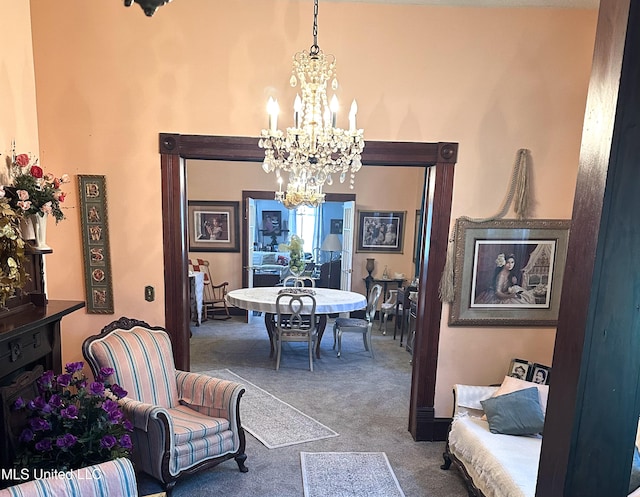 carpeted dining space with an inviting chandelier