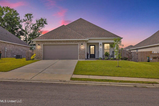 18109 Evergreen Dr, Gulfport, MS 39503 - view of front of house with a garage, driveway, brick siding, and roof with shingles