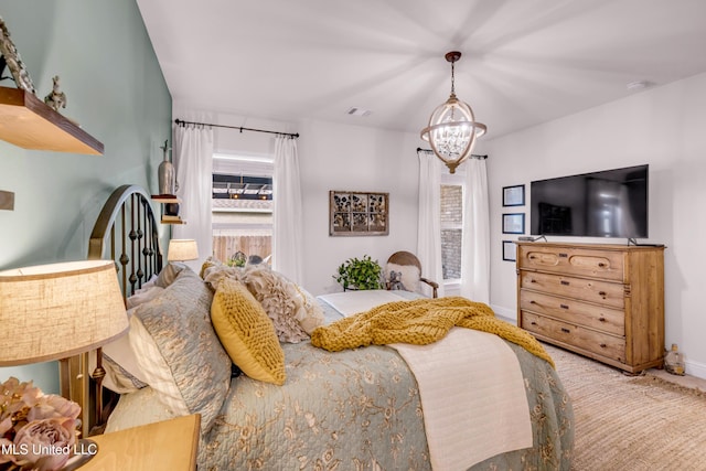 18109 Evergreen Dr, Gulfport, MS 39503 - carpeted bedroom featuring a chandelier and baseboards