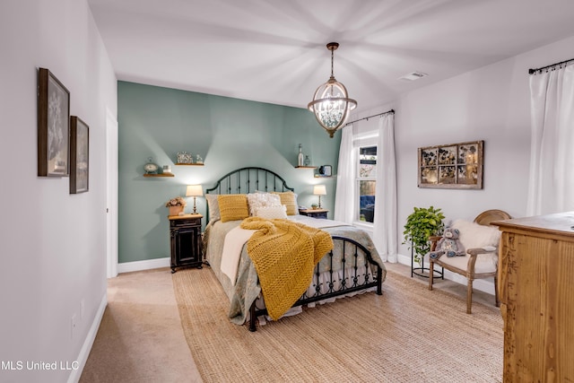 18109 Evergreen Dr, Gulfport, MS 39503 - bedroom featuring light colored carpet and a chandelier