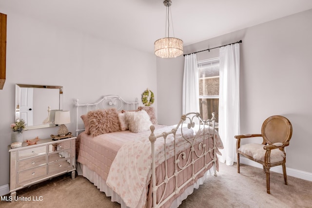 18109 Evergreen Dr, Gulfport, MS 39503 - carpeted bedroom with baseboards and a chandelier