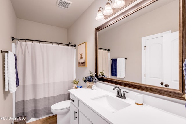 18109 Evergreen Dr, Gulfport, MS 39503 - full bathroom featuring vanity, wood finished floors, and a shower with curtain