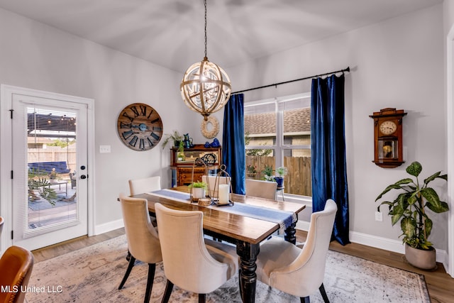 18109 Evergreen Dr, Gulfport, MS 39503 - dining area featuring a chandelier and light wood-style flooring